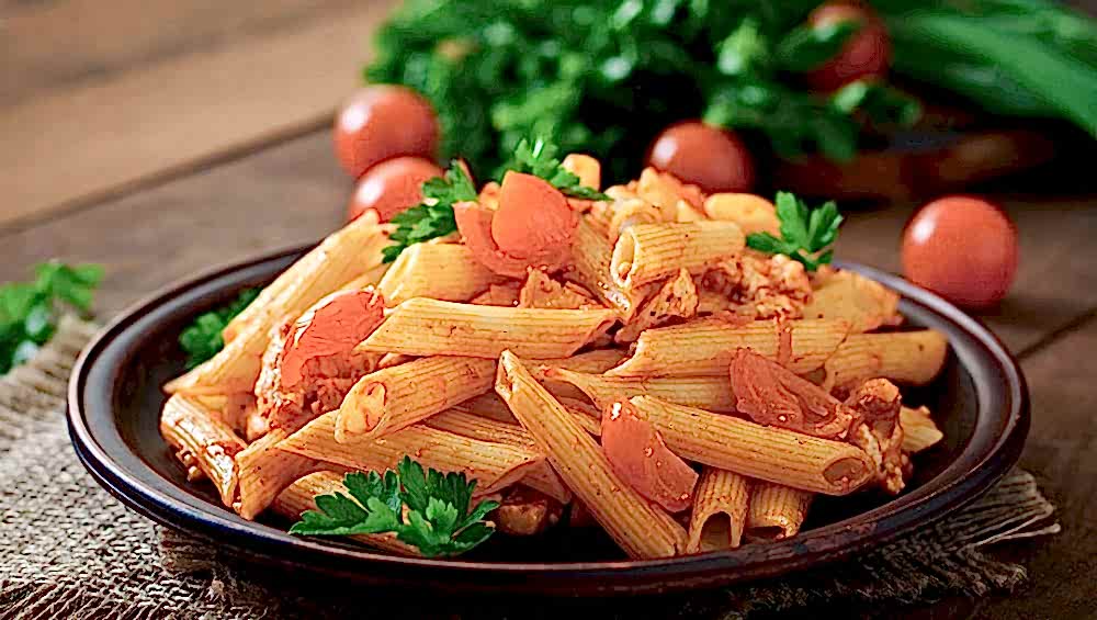 penne-pasta-tomato-sauce-with-chicken-tomatoes-wooden-table